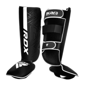 espinilleras para combate marca rdx color negro con detalles en blanco